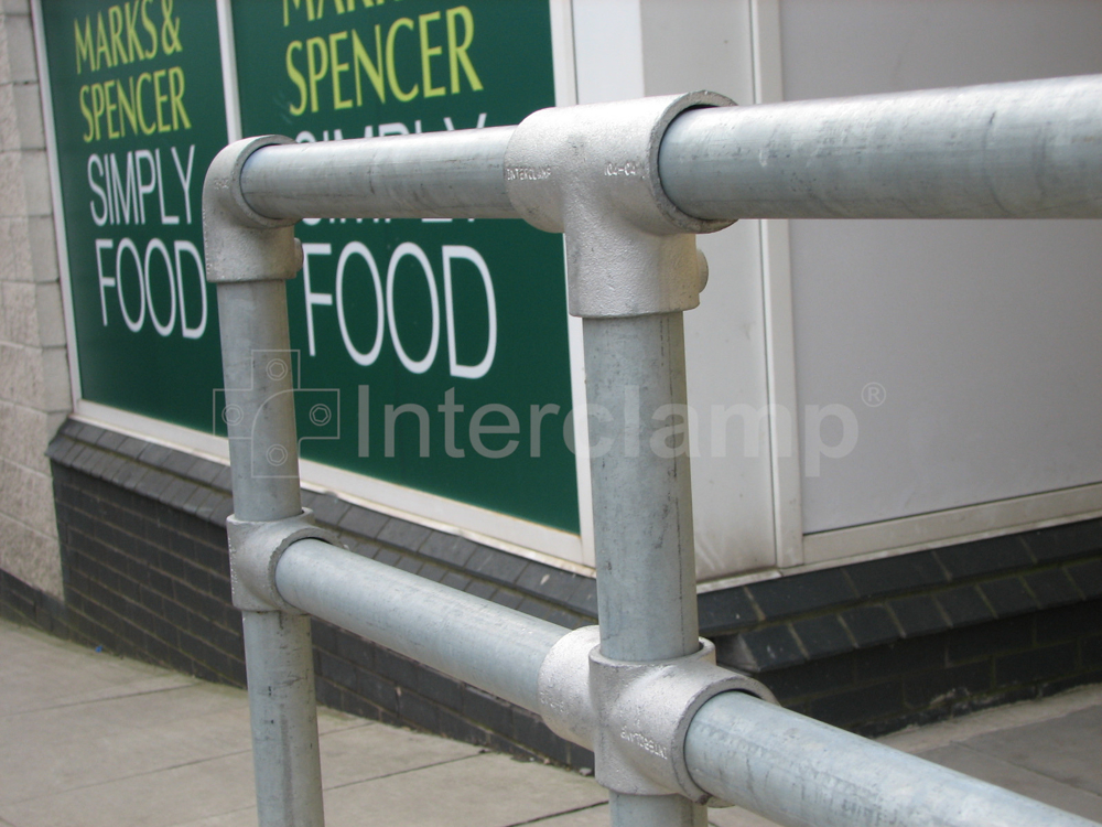 Interclamp 4000 series style galvanised double rail key clamp guardrail constructed at the retail park